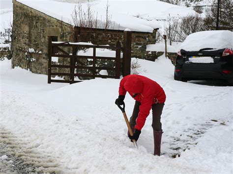 UK weather latest: Severe warnings remain in place as Britain counts ...