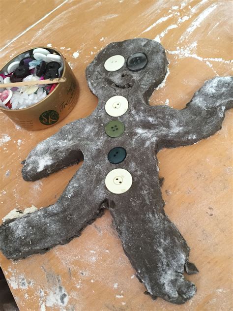 Gingerbread playdough.. brown playdough with ginger spice mixed in. We used buttons for eyes and ...