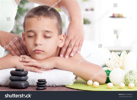 Young Boy Relaxing In Spa. Stone Massage. Stock Photo 222298300 ...