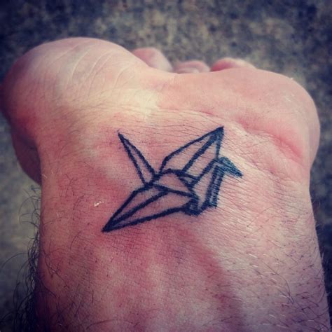 Origami crane tattoo on wrist. | Wrist tattoos, Origami tattoo, Paper ...