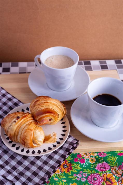 cup of coffee and croissant 10978013 Stock Photo at Vecteezy