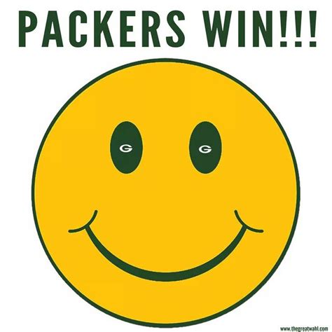 a yellow smiley face with the words packers win