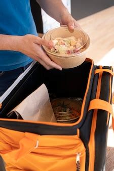 Free Photo | Man preparing takeaway food for delivery