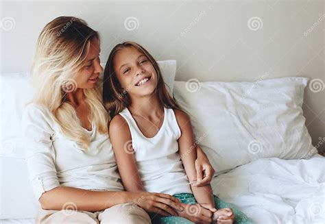 Mom with tween daughter stock image. Image of bedding - 70120611