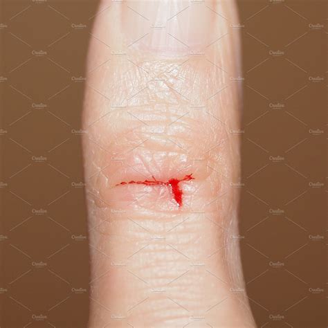 Paper cut with blood | Stock Photos ~ Creative Market