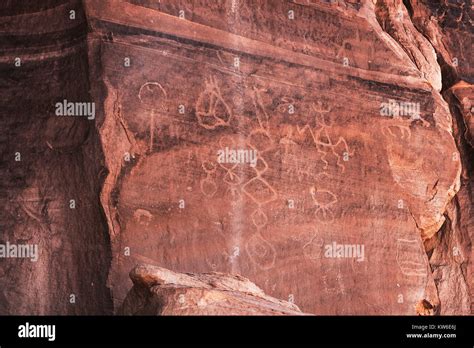 Carved Anasazi petroglyphs representing esoteric symbols on a sandstone ...