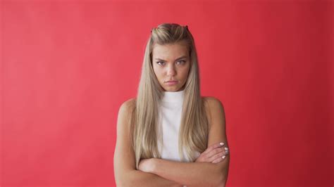 Angry woman face expression. Resentful. Close up of upset model face ...