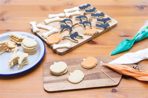 Premium Photo | Process of decorating cookies for halloween homemade pastry