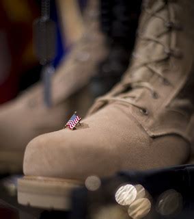 140813-A-AJ780-014 | A U.S. flag pin placed by a mourner on … | Flickr