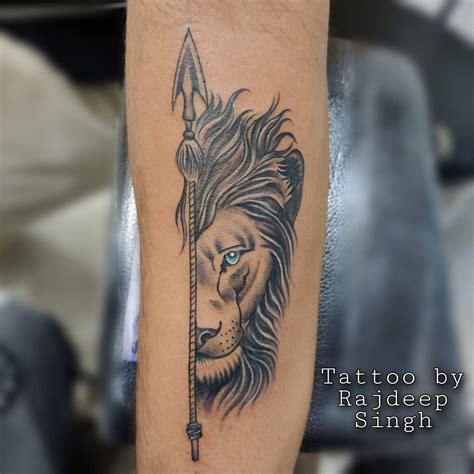 Lion Tattoo with Arrow Design