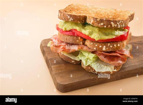 Sandwich LGBT lettuce, guacamole, bacon and tomato Stock Photo - Alamy