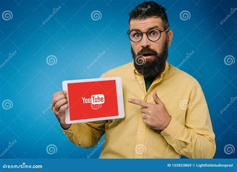 Surprised Bearded Man Pointing at Digital Tablet with Youtube App, Isolated Editorial Stock ...