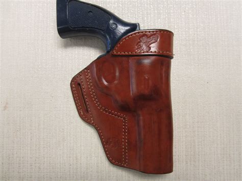 ITEM S&W 586 & 686 357 MAGNUM WITH 4" BARREL, formed BROWN leather owb, belt slot holster