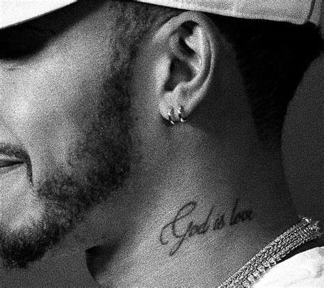 “God is love” tattoo on Lewis Hamilton's left side