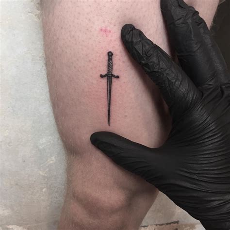 Tiny sword was done by Nerdy Match Marco - Tattoogrid.net