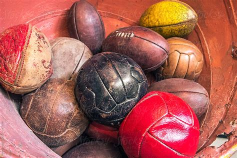 "Collection Of Old Soccer Balls" by Stocksy Contributor "Rowena Naylor" - Stocksy