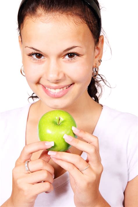 Young Woman With Green Apple Free Stock Photo - Public Domain Pictures
