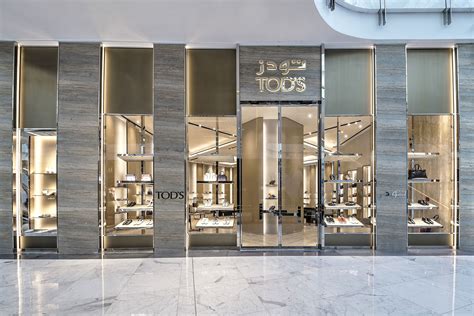 TOD'S Dubai Mall | Supermarket design, Shop interior design, Jewelry ...