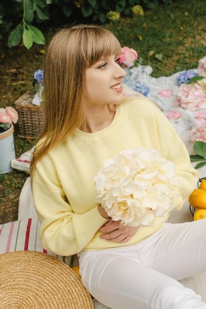 Premium Photo | Beautiful girl on a picnic with flowers