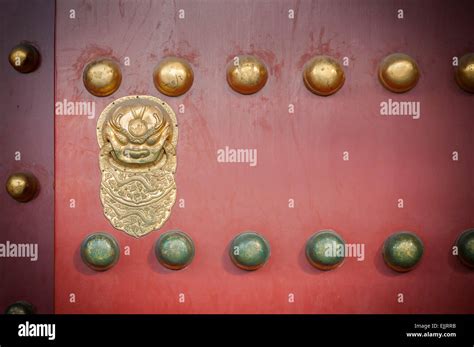 Red wooden door with golden lion figure at the Forbidden City, Beijing Stock Photo - Alamy