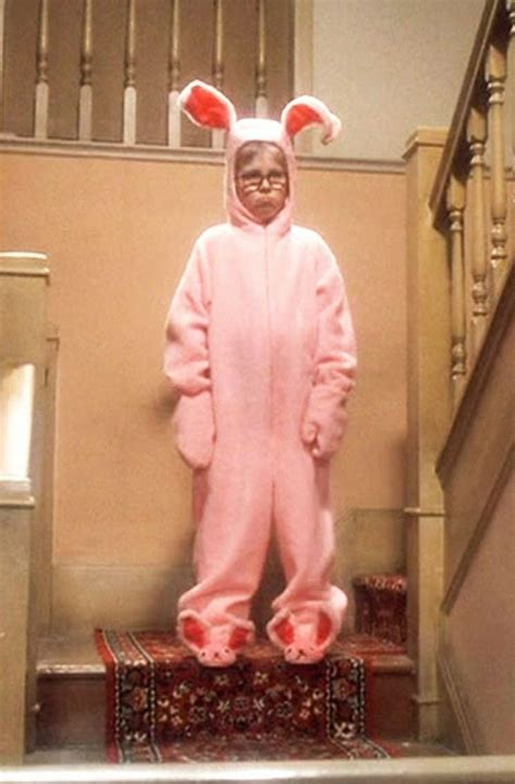 a person in a pink bunny costume standing on some stairs