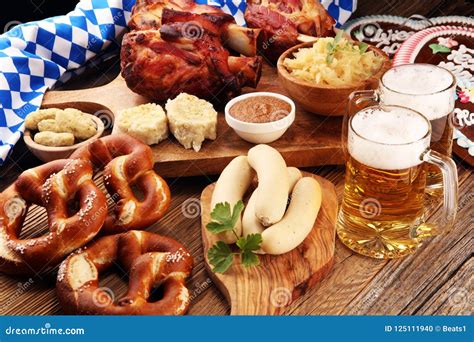 Traditional German Cuisine, Schweinshaxe Roasted Ham Hock. Beer, Pretzels and Various Bavarian ...