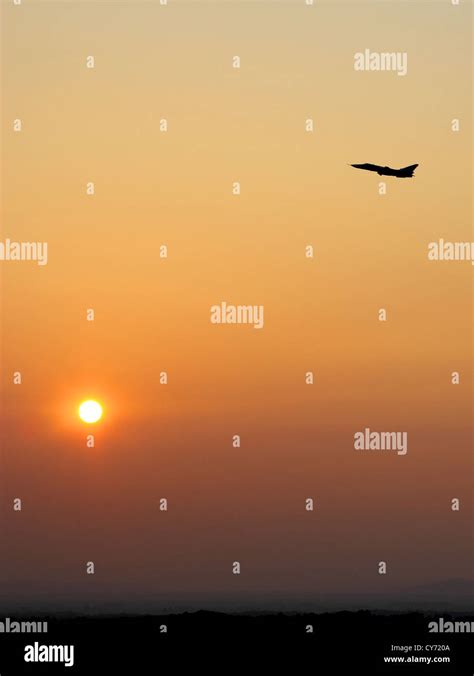 Aircraft takeoff at sunset Stock Photo - Alamy