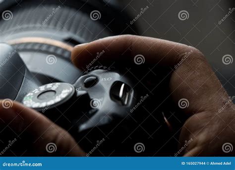 Man`s Hand Holding a DSLR Camera Stock Photo - Image of shot, hand ...