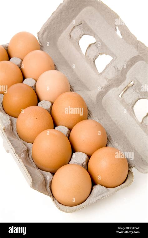 brown eggs in carton with white background Stock Photo - Alamy