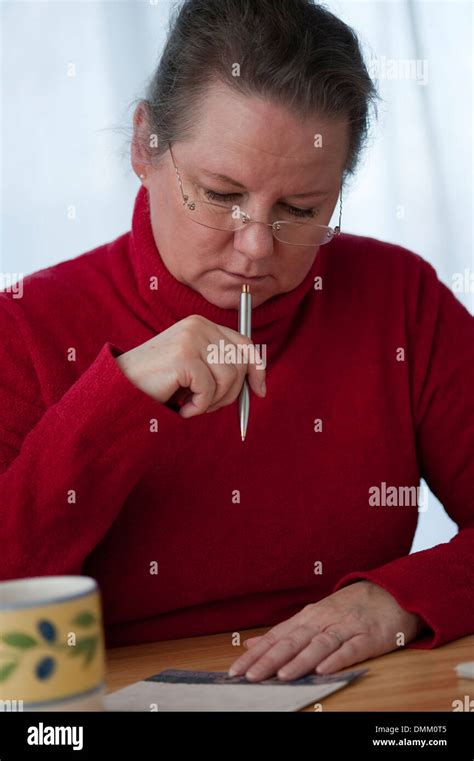 Mature woman write letter indoors hi-res stock photography and images - Alamy