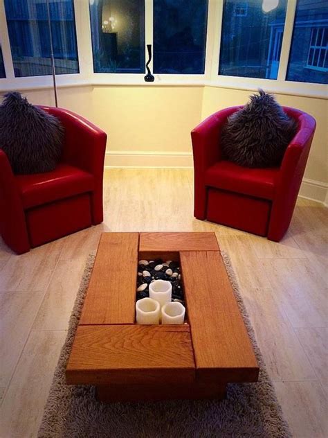 two red chairs sitting next to each other in a living room
