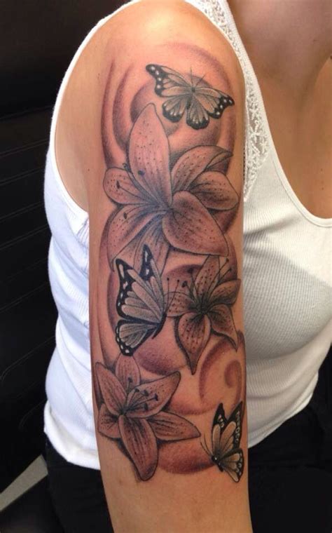 Lily & butterfly design Tattoos For Women Half Sleeve, Dope Tattoos For Women, Shoulder Tattoos ...