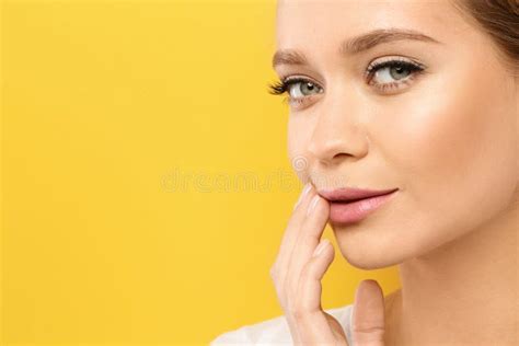 Young Woman Wearing Nude Lipstick on Color Background. Stock Image - Image of hand, face: 140132983