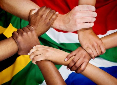 Rainbow Nation Hands Clasped In Unity Against South African Flag Stock ...