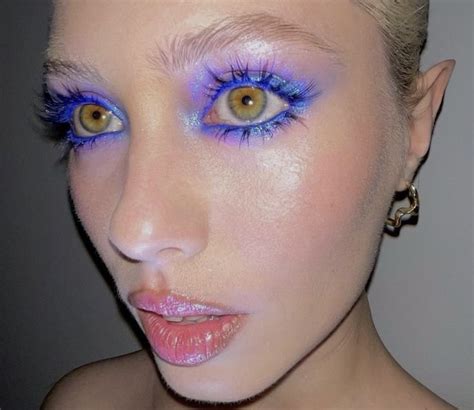 Bold neon blue electric glowy eye makeup and eye shadow look with long ...
