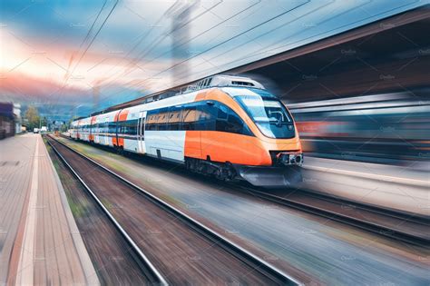 High speed orange train in motion | High-Quality Transportation Stock Photos ~ Creative Market