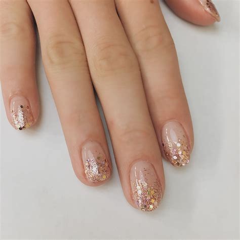 Looking for nail art ideas? Try a rose gold glitter ombre! Holiday nails. Nail ideas. Negative ...