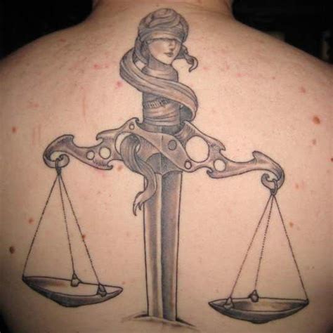 scales-of-justice-tattoo-on-back – Prison Writers