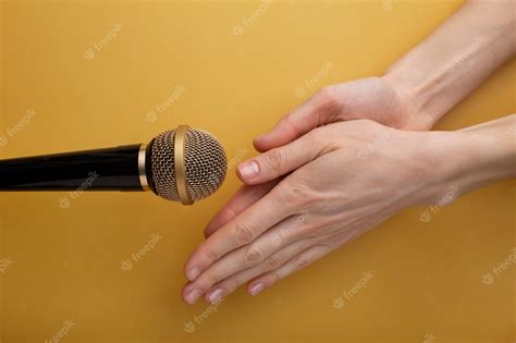 Premium Photo | Person rubbing hands close to microphone for asmr