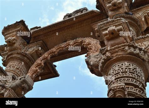 Carved old hindu temple arched gate in india Stock Photo - Alamy