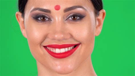 Portrait of Beautiful Indian Woman with Red Dot on Forehead Looking at Camera and Smiling ...