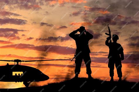 Premium Photo | Silhouette of a soldiers and helicopter at sunset