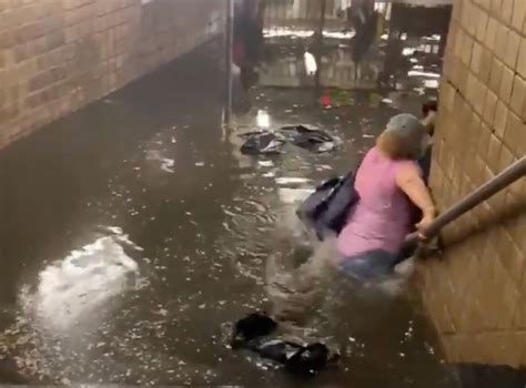 Videos show New Yorkers wading through ‘chest high’ floodwater in subway stations after downpour ...