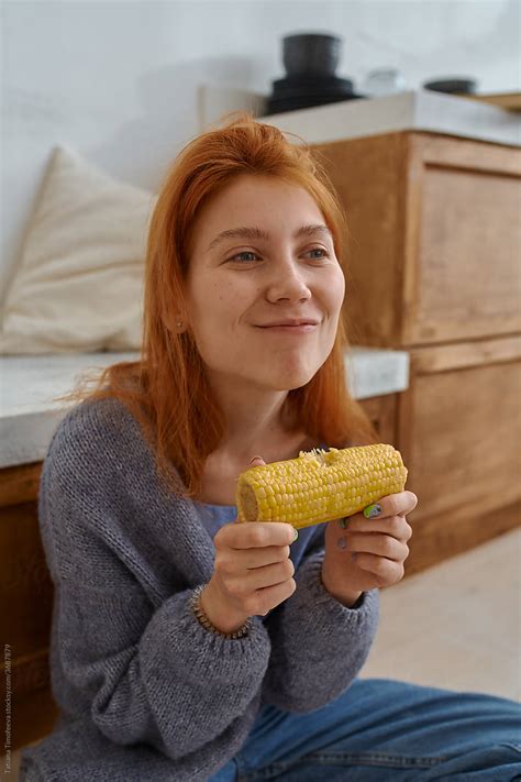 "Girl Eats A Vegetable" by Stocksy Contributor "Tatiana Timofeeva" - Stocksy