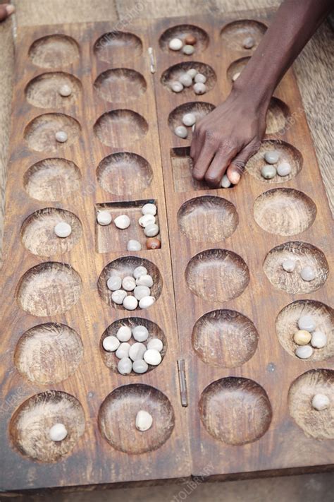 Mancala board game - Stock Image - C041/0340 - Science Photo Library