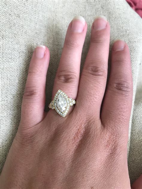 Love my custom ring...he knows me so well... I had no idea. 2ct middle stone : r/weddingring
