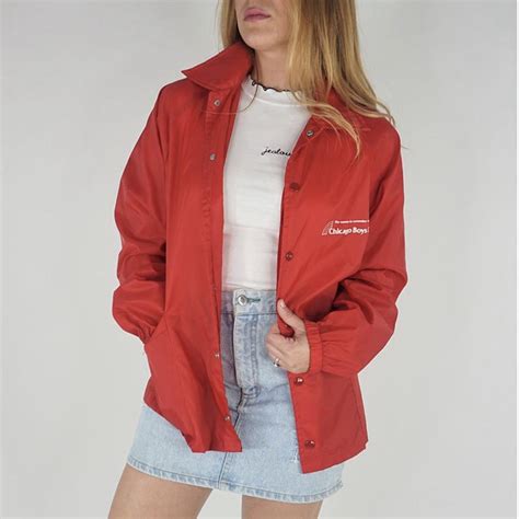 Red coach style windbreaker jacket featuring snap... - Depop