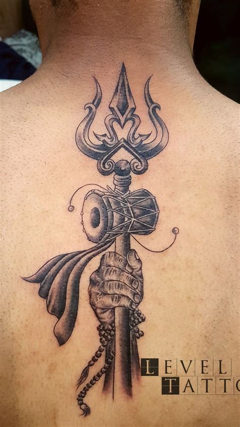 Trishul tattoo done by Billu tattoo at level ink tattoos | Shiva tattoo ...