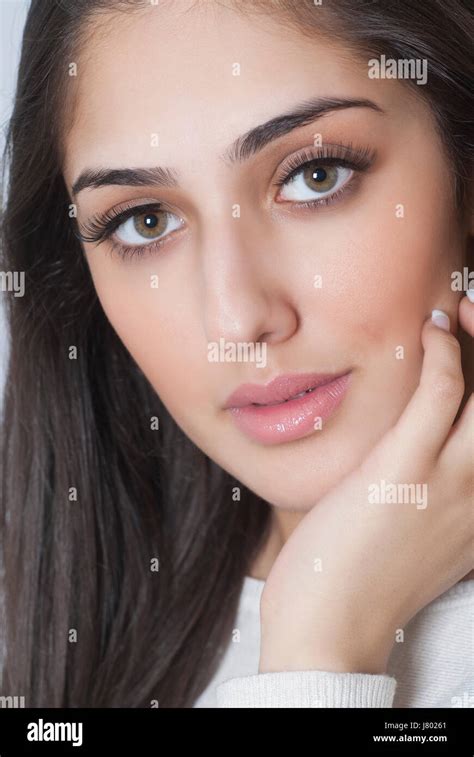 Beautiful Indian woman hand touching face Stock Photo - Alamy