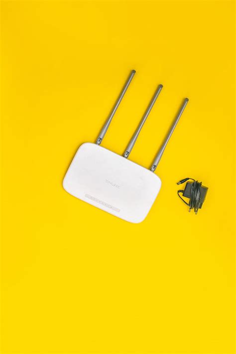 Wifi Router on Yellow Background · Free Stock Photo